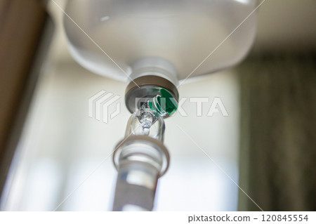 Close up medical intravenous IV drip in hospital background 120845554