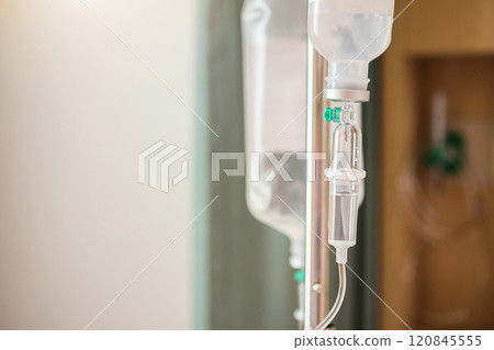 Close up medical intravenous IV drip in hospital background Close up medical intravenous IV drip in hospital background 120845555