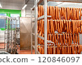 Sausages hanging in a modern food processing plant 120846097