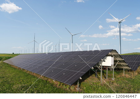Solar panels and wind turbines on a field. Sustainable energy Solar panels and wind turbines on a field. Sustainable energy 120846447