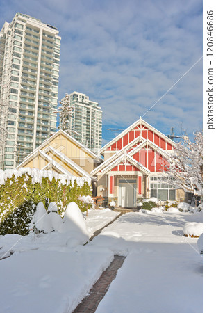 Modern high-rise and private residential houses in snow on winter season 120846686