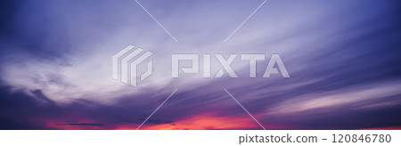 Clouds against a background of purple cloudy dramatic sky at sunset in evening. Panorama of the sky 120846780