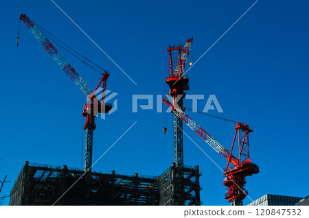 Three giant cranes for building construction 120847532