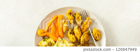 This flavorful meal includes fried zucchini flowers in golden batter, a tender cauliflower omelette with stewed peppers ideal for a healthy diet, banner This flavorful meal includes fried zucchini flowers in golden batter, a tender cauliflower omelette with stewed peppers ideal for a healthy diet, banner 120847949