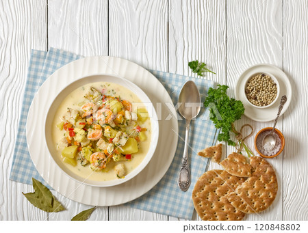 seafood chowder in a white bowl, top view seafood chowder in a white bowl, top view 120848802