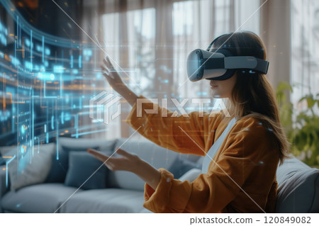 Woman Interacting with Holographic Display Using VR Headset Woman Interacting with Holographic Display Using VR Headset 120849082