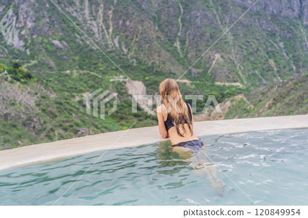 Female tourist at the hot springs of Grutas Tolantongo, Mexico. Adventure, relaxation, and natural wellness concept 120849954