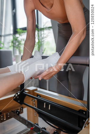 Engage in a Pilates Reformer Session held in a Contemporary and Modern Studio Space Engage in a Pilates Reformer Session held in a Contemporary and Modern Studio Space 120850024