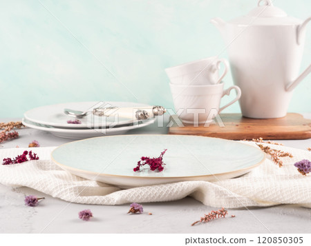 Tea breakfast table setting concept on pastel blue background 120850305