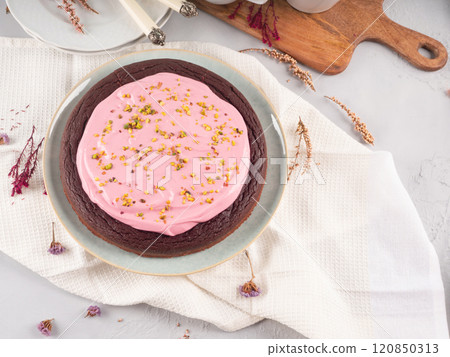 Beetroot chocolate cake with pink cream cheese pistachio icing Beetroot chocolate cake with pink cream cheese pistachio icing 120850313