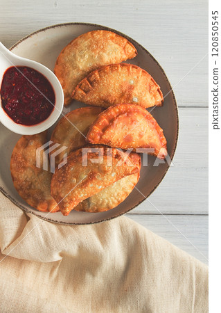 Fried chebureks, close-up, on a light background, no people, Fried chebureks, close-up, on a light background, no people, 120850545