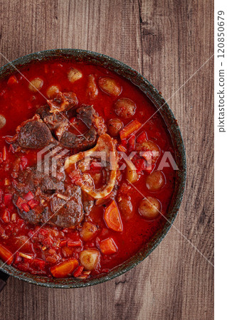 ossobuco stew with vegetables, knuckle on the bone with new potatoes, in tomato sauce,homemade, top view, no people, 120850679