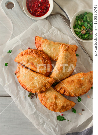 Fried chebureks, close-up, on a light background, no people, Fried chebureks, close-up, on a light background, no people, 120850745