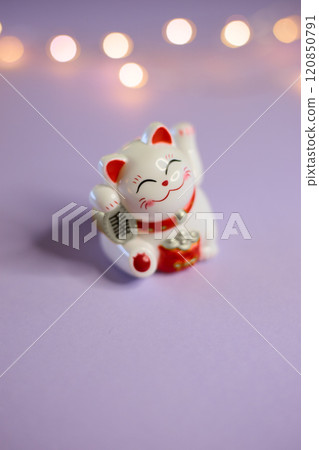 Charming and Adorable Lucky Cat Figurine Featuring a Cheerful and Joyful Expression 120850791