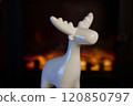 A Stylish White Moose Figurine Perfectly Positioned Against a Beautifully Cozy Background 120850797