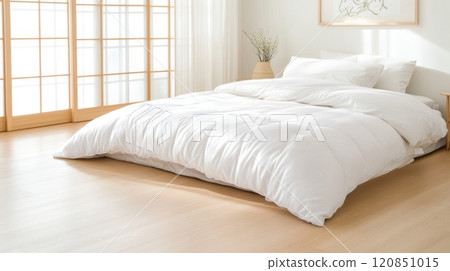 Experience a serene space with a Japanese futon on wooden floors and soft light filtering through rice paper doors 120851015