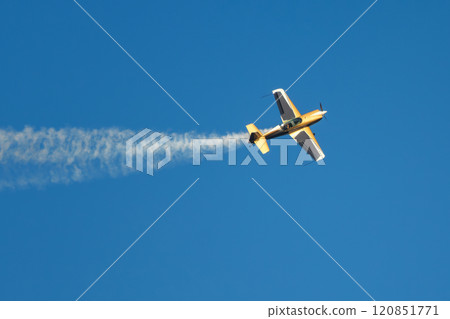 Stunt aerobatic plane performing stunts in air 120851771