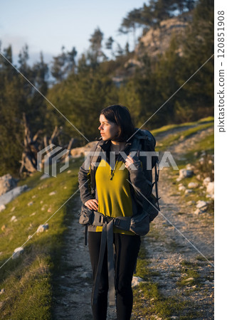 Girl is hiking, trekking in the mountains and woodland. Girl is hiking, trekking in the mountains and woodland. 120851908