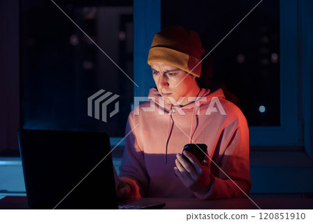 Man is working on a laptop at night. Man is working on a laptop at night. 120851910