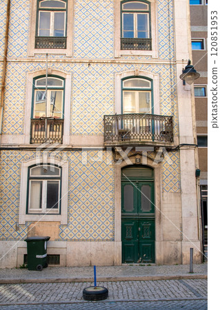 Lisbon, Portugal, facade of colorful old houses with windows, European historical buildings, cozy cityscape, Portuguese streets landscape Lisbon, Portugal, facade of colorful old houses with windows, European historical buildings, cozy cityscape, Portuguese streets landscape 120851953