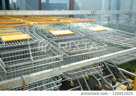 Shopping carts all lined up ready to be used to get groceries at store Shopping carts all lined up ready to be used to get groceries at store 120852020