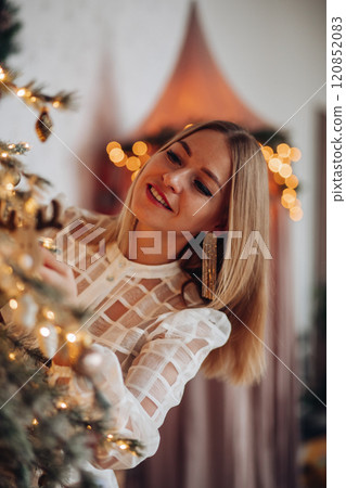 A beautiful stylish woman in a white dress near 120852083