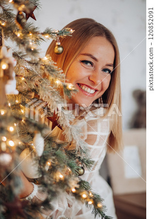 A beautiful stylish woman in a white dress near A beautiful stylish woman in a white dress near 120852091