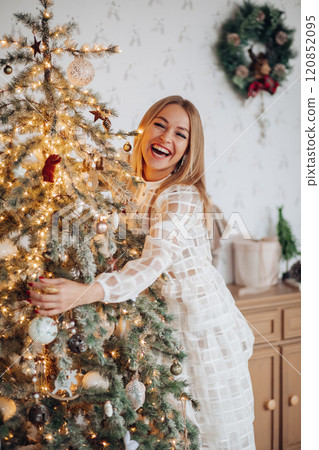 A beautiful stylish woman in a white dress near A beautiful stylish woman in a white dress near 120852095