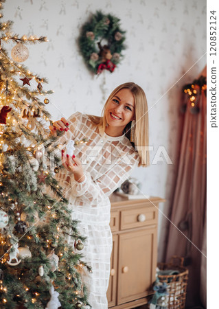 A beautiful stylish woman in a white dress near 120852124