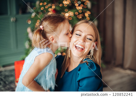 Little girl and her mom on Christmas morning at Little girl and her mom on Christmas morning at 120852241