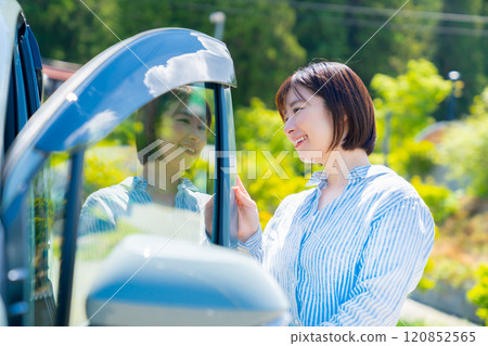 A woman on a road trip in a car Car and woman 120852565