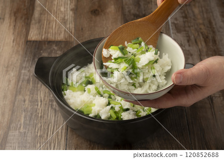 Put the rice into a bowl 120852688