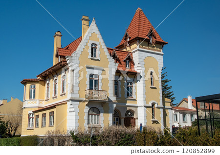 Lisbon, Portugal, historical building facade, an old European yellow house with windows, cozy cityscape, Portuguese streets landscape Lisbon, Portugal, historical building facade, an old European yellow house with windows, cozy cityscape, Portuguese streets landscape 120852899