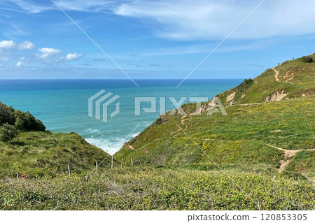 Panorama of the ocean coast and rock bay, Atlantic Ocean, beautiful cloudscape, dramatic landscape, colorful seascape with sheer rocks, travel content, Lisbon, Portugal 120853305