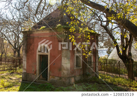 Facade of a historical building in the garden, old peeling paint wall, vintage rustic background, Lisbon, Portugal 120853519