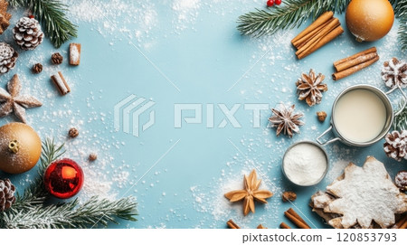 Christmas-themed ingredients and decorations, including cinnamon sticks, star anise, powdered sugar, gingerbread cookies, pinecones 120853793