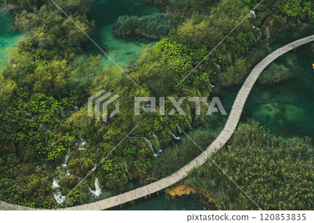Aerial top down view of a wooden walkway in Plitvice Lakes National Park with small waterfalls Aerial top down view of a wooden walkway in Plitvice Lakes National Park with small waterfalls 120853835