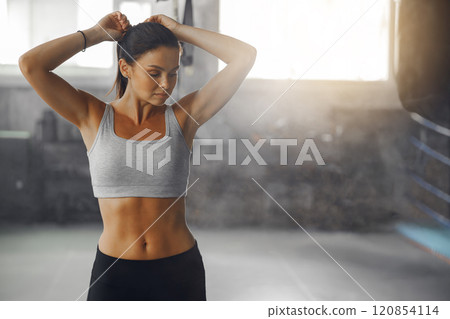 A Fitness Enthusiast Dressed in Active Wear Engaging in Activities at the Gym Facility A Fitness Enthusiast Dressed in Active Wear Engaging in Activities at the Gym Facility 120854114