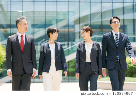 Businessmen walking in front of the office 120854997