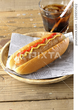 Hot dog with ketchup and mustard and a cola 120855422