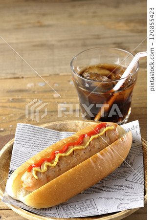 Hot dog with ketchup and mustard and a cola Hot dog with ketchup and mustard and a cola 120855423