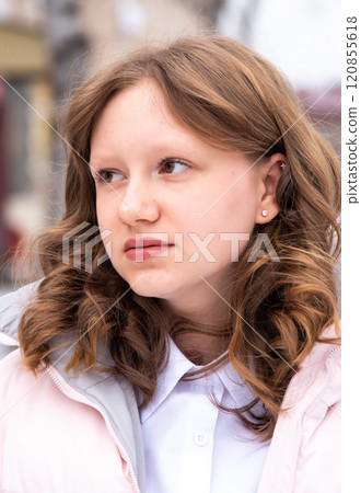 Portrait of Russian 15 years old girl in winter jacket looking left, close up Portrait of Russian 15 years old girl in winter jacket looking left, close up 120855618