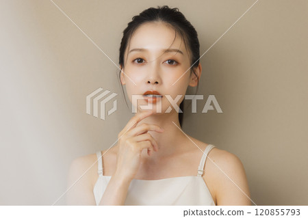 Woman smiling with hands on face 120855793