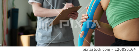 Reviewing Athletic Tape Application During Physical Therapy Session 120856164