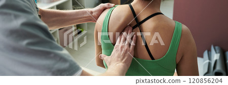 Receiving Physical Therapy Treatment from Therapist 120856204