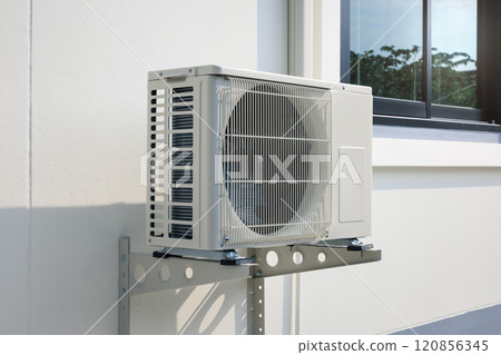 Condenser unit outside home. 120856345
