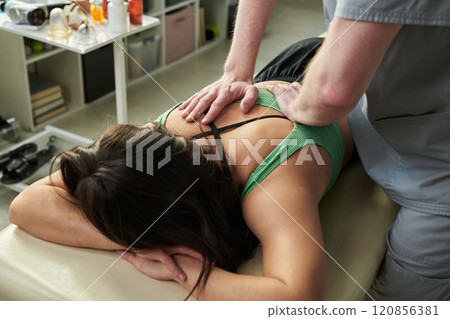 Receiving Therapeutic Massage in a Clinic Setting 120856381