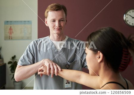 Assisting Patient with Physical Therapy Exercise Technique 120856509