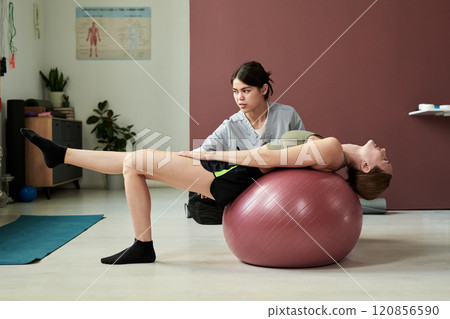 Assisting Physical Therapy Session for Injury Recovery Assisting Physical Therapy Session for Injury Recovery 120856590