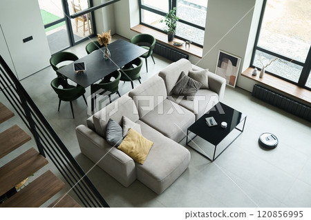Modern Living Room with Dining Area and Large Windows Modern Living Room with Dining Area and Large Windows 120856995